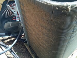 AC-condenser-unit-covered-in-dirt