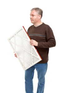 person-changing-an-air-conditioner-air-filter