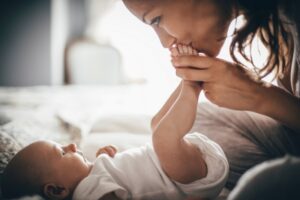 mother-kissing-a-tiny-baby's-feet