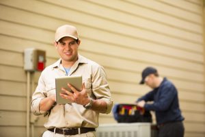 AC-technicians-getting-the-outdoor-AC-unit-set-up-and-working